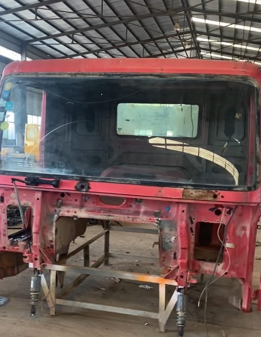 Center console and internal wiring harness inspection inside the stripped cab