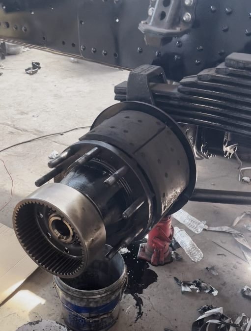 Fully overhauled axle assembly with new hub oil seals and brake linings