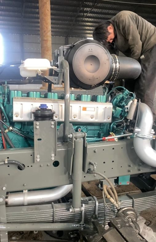 Engine, transmission and air system assemblies installed on the rebuilt chassis