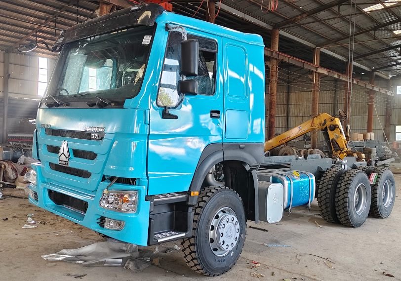 Completed heavy-duty chassis resting on new wheels and tires