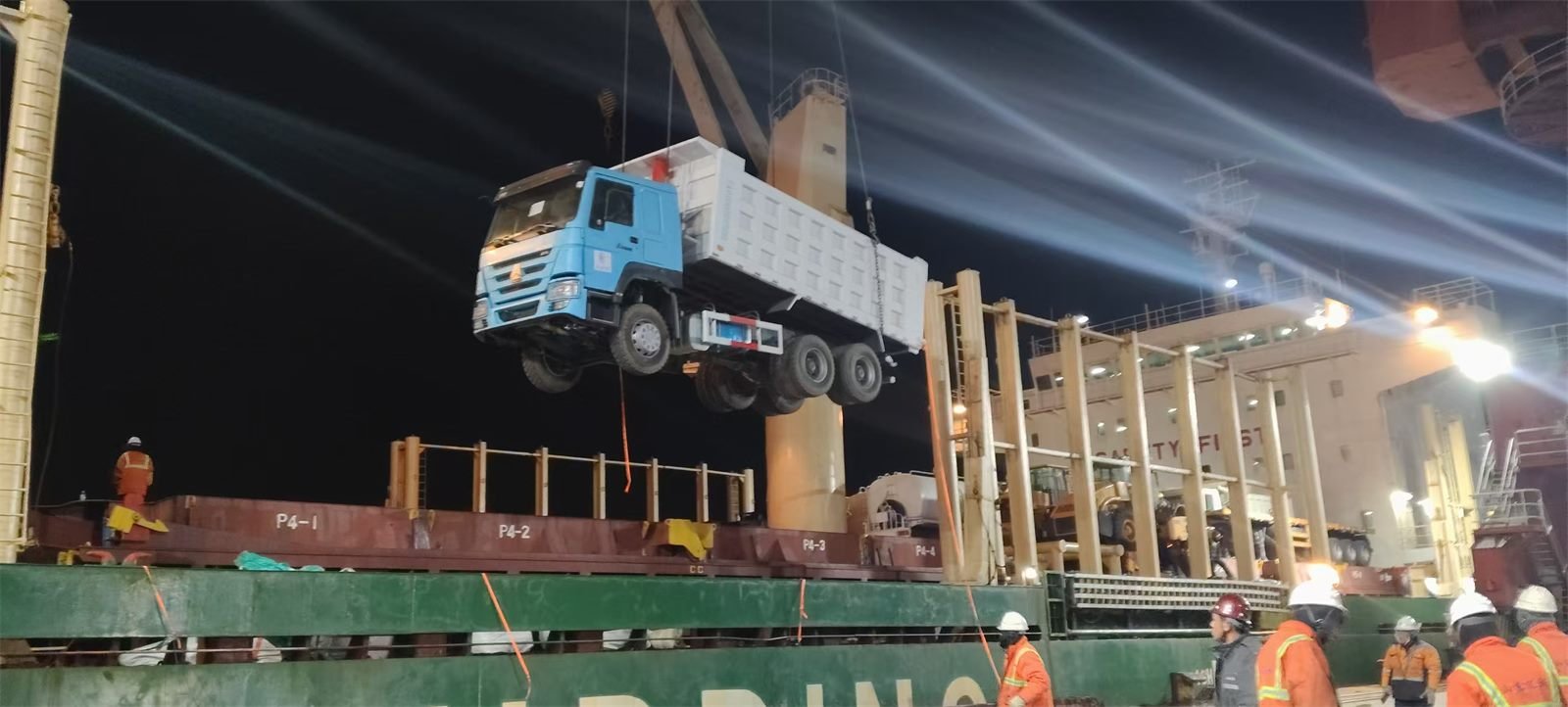 Refurbished trucks arriving at the port for loading